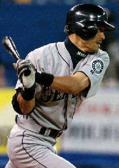 
Ichiro Suzuki singles in the fifth inning. 
 (Associated Press / The Spokesman-Review)