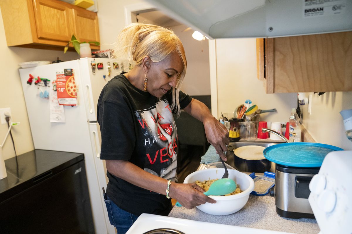 Bonita Williams prepares her lunch at home for work the next day. Williams, who recently went to the hospital having chest pains, said, "I think it is all the stress at work that is making me not feel good. I just like to be comfortable and do my job. I don