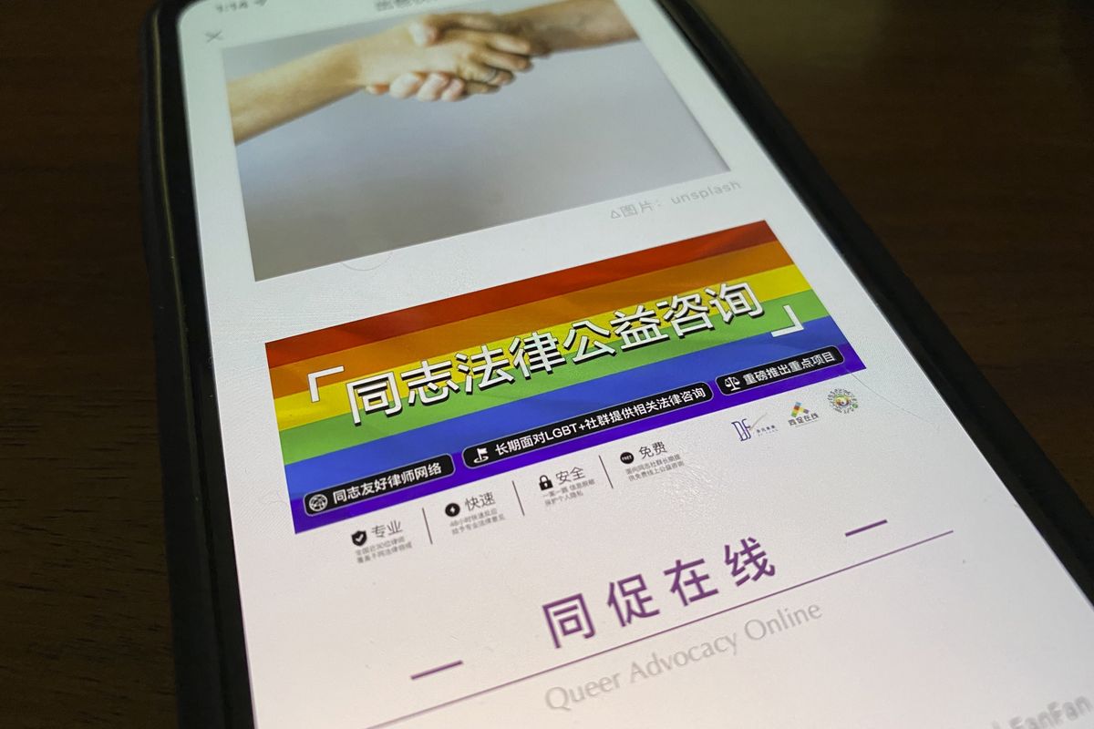 An online post about the work of the LGBT Rights Advocacy Group with a link to their social media account Queer Advocacy Online is displayed on a phone in Beijing, China, Friday, Nov. 5, 2021. The LGBT advocacy group in China that has spearheaded many of the country