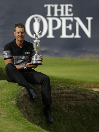 Henrik Stenson of Sweden poses with the trophy after winning the British Open Golf Championships at the Royal Troon Golf Club in Troon, Scotland. (Matt Dunham / Associated Press)