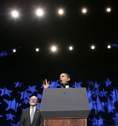 New Jersey Gov. Jon Corzine listens as President Barack Obama speaks Sunday at a rally for Corzine.  (Associated Press / The Spokesman-Review)