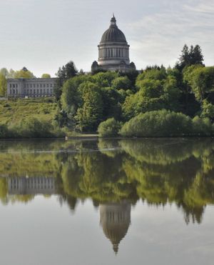 OLYMPIA – The dome of the Washington Capitol, reflected in Capitol Lake on a calm day. (Jim Camden / The Spokesman-Review)