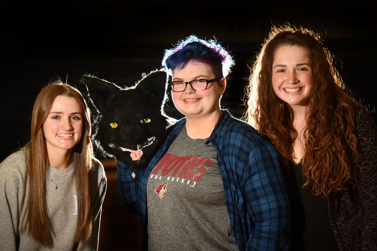 Freeman High School junior Abbey Wigen, center, has created a wolf mask with fur for prom. The theme was “Mask-querade.” Junior Kaylie Smith, left, is organizing the event for seniors like Gracie Jensen, at right.  (Dan Pelle/THESPOKESMAN-REVIEW)