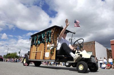
Marc Kroetch entertains parade-goers in 2005 on Rathdrum's downtown streets with his highly customized lawn mower shaped like a hearse that he calls the 