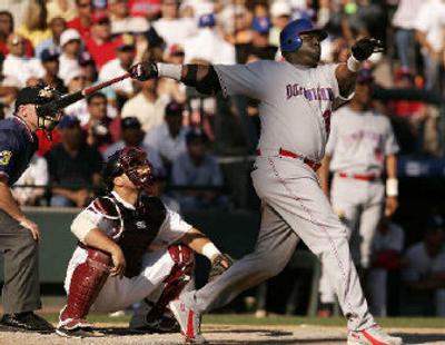 
David Ortiz slugs a two-run homer in the ninth for the Dominican Republic during Tuesday's win over Venezuela. 
 (Associated Press / The Spokesman-Review)