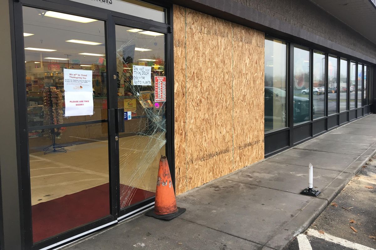 An SUV slammed into the front entrance of De Leon Foods, 102 E. Francis Avenue, Monday, Nov. 20, 2017. (Colin Mulvany / The Spokesman-Review)