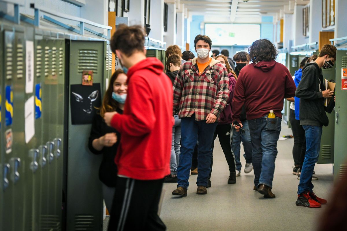 Tekoa High School students gather in the hallway before heading to classrooms to take final exams Tuesday. The Tekoa School District taught students in person in school all year with no reported in-school transmission.  (Dan Pelle/THESPOKESMAN-REVIEW)