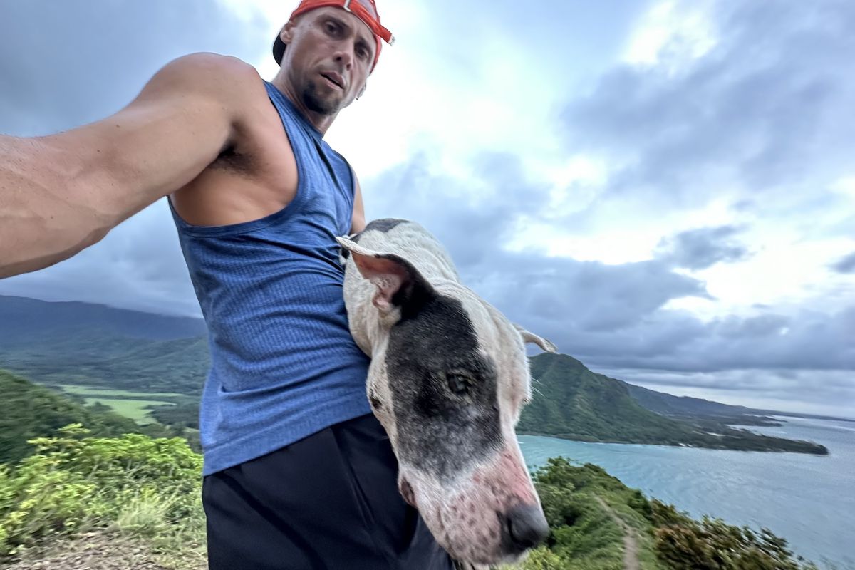 Sergio Florian with Stevie on top of Pu’u Manamana mountain on Oahu’s North Shore.  (Sergio Florian)