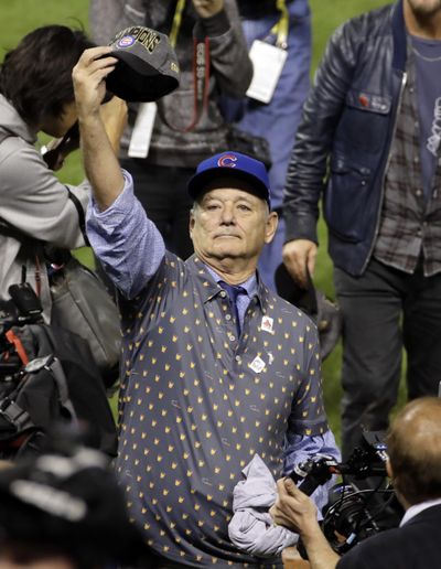 Bill Murray celebrates after Wednesday’s Game 7 of the Major League Baseball World Series between the Cleveland Indians and the Chicago Cubs T in Cleveland. The Cubs won 8-7 in 10 innings to win the series 4-3. (Gene J. Puskar / Associated Press)