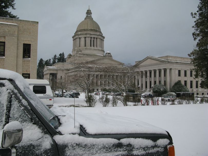 Snow, a rarity in Olympia, has brought things to a near-standstill in the capital. (Rich Roesler / The Spokesman-Review)