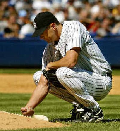 
Yankees pitcher Kevin Brown added to his frustrating season by breaking his left wrist after punching a dugout wall. 
 (Associated Press / The Spokesman-Review)