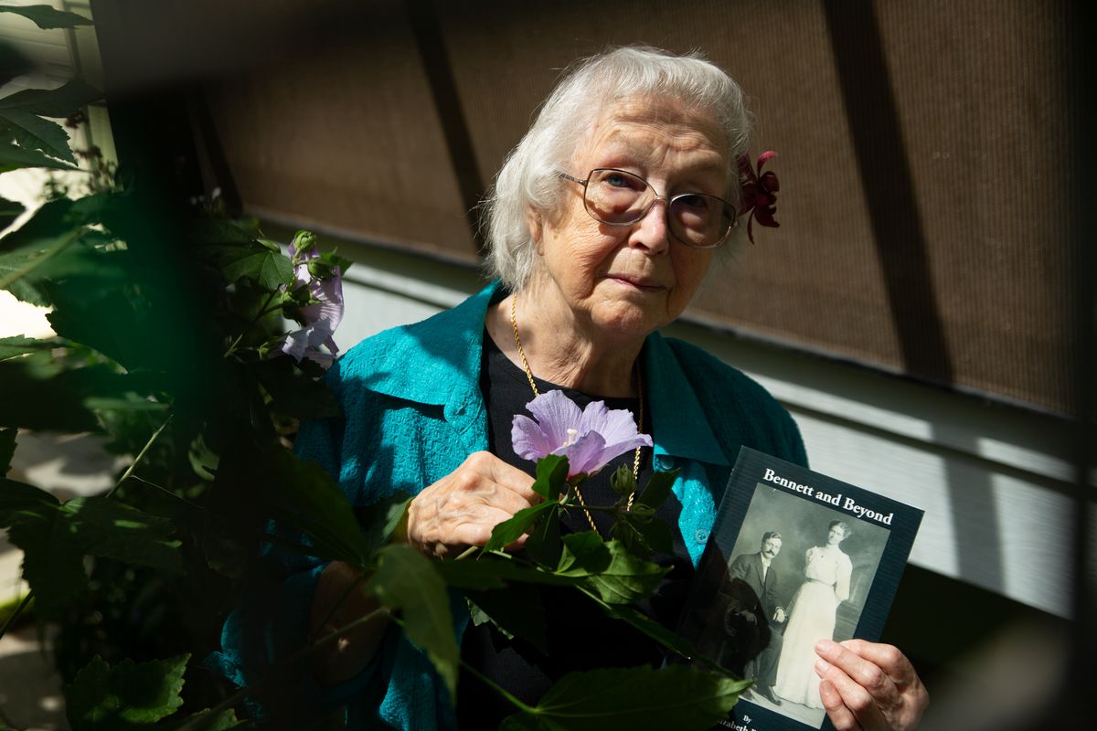 Fran Wicht poses with a copy of her recently-completed book, “Bennett and Beyond,” in her sunroom on July 8. Wicht’s newest book is about her father but is far from the first book she authored. It is actually book No. 4 in her lineup from Spokane-based Gray Dog Press.  (Libby Kamrowski/ THE SPOKESMAN-REVIEW)