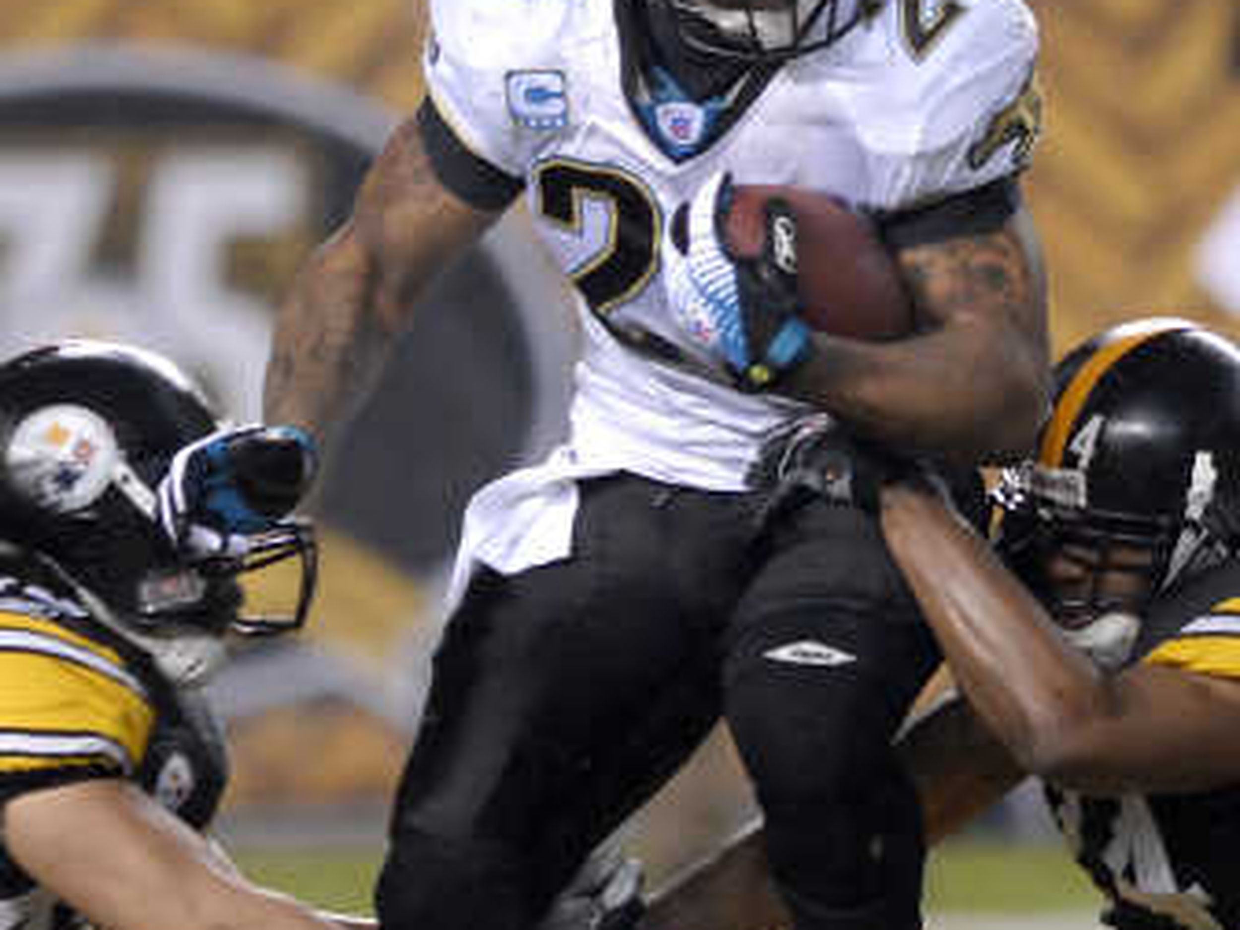 Jacksonville Jaguars QB David Garrard smiles after a play against