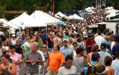 
People pack the downtown Street Fair in Coeur d'Alene last year. Art on the Green, Street Fair and the Taste of the Coeur d'Alenes will bring thousands of shoppers, eaters and browsers to Coeur d'Alene this weekend.
 (File/File/ / The Spokesman-Review)