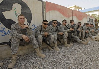 U.S. Army soldiers wait to go out on patrol in Baladiyat, an eastern neighborhood of Baghdad,  on Thursday. Sunni and Shiite lawmakers on Thursday warned that political and economic challenges could derail Iraq’s progress toward stability as the country enters its seventh year of war.  (Associated Press / The Spokesman-Review)