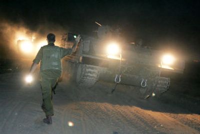 
Israeli military vehicles advance toward the Gaza Strip  early today. Israeli troops entered southern Gaza, , putting more pressure on Palestinian militants to release a 19-year-old Israeli soldier.
 (Associated Press / The Spokesman-Review)