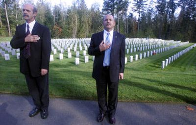 
Mike Gregoire, right, husband of Gov. Chris Gregoire, stands with Tahoma National Cemetery director Joe Turnbach  in October at the cemetery near Kent, Wash.  The state's only such cemetery, Tahoma is far from home for the hundreds of thousands of veterans in Eastern Washington and North Idaho, posing a dilemma for loved ones when they die. 
 (Associated Press / The Spokesman-Review)