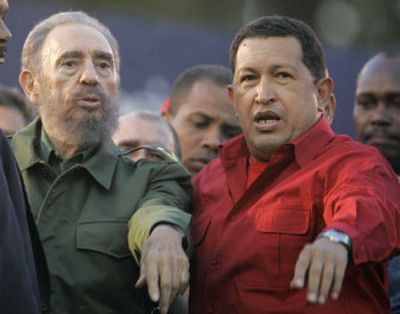 
Cuba's President Fidel Castro and Venezuela's President Hugo Chavez attend the Mercosur summit in Cordoba, Argentina, on Friday.
 (Associated Press / The Spokesman-Review)