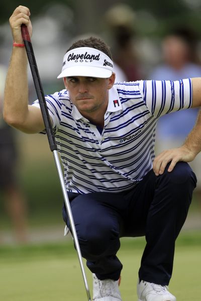 Keegan Bradley lines up his putt on the first hole during the third round of the Bridgestone Invitational Saturday in Akron, Ohio. (Associated Press)