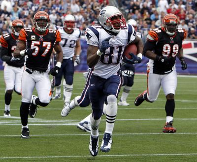 Wide receiver Randy Moss has left New England in his dust and will reunite with Minnesota.  (Associated Press)