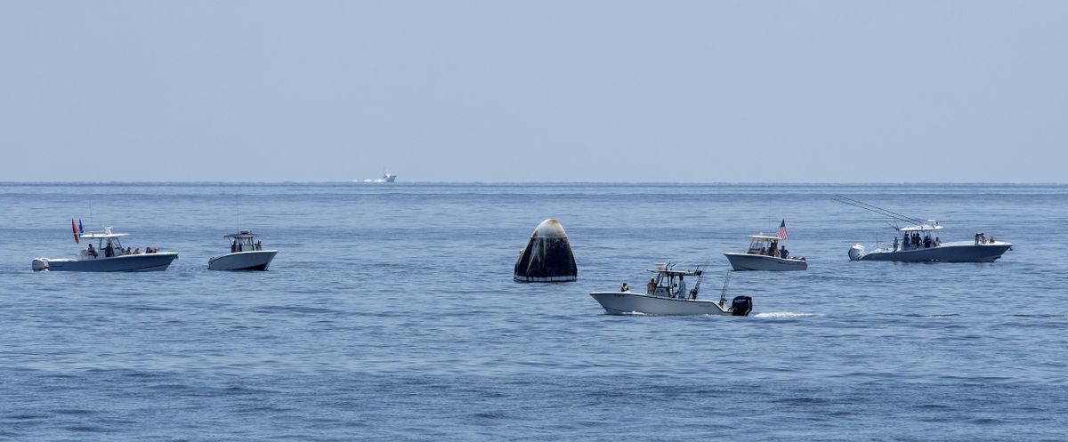 In this Sunday, Aug. 2, 2020 photo provided by NASA, support teams and curious recreational boaters arrive near the SpaceX Crew Dragon Endeavour spacecraft in the Gulf of Mexico off the coast of Pensacola, Fla. For the Wednesday, April 28, 2021 planned splashdown, NASA and SpaceX are promising more Coast Guard patrols and fewer pleasure boaters off the Florida panhandle coast for the company's second return of a crew.  (Bill Ingalls)
