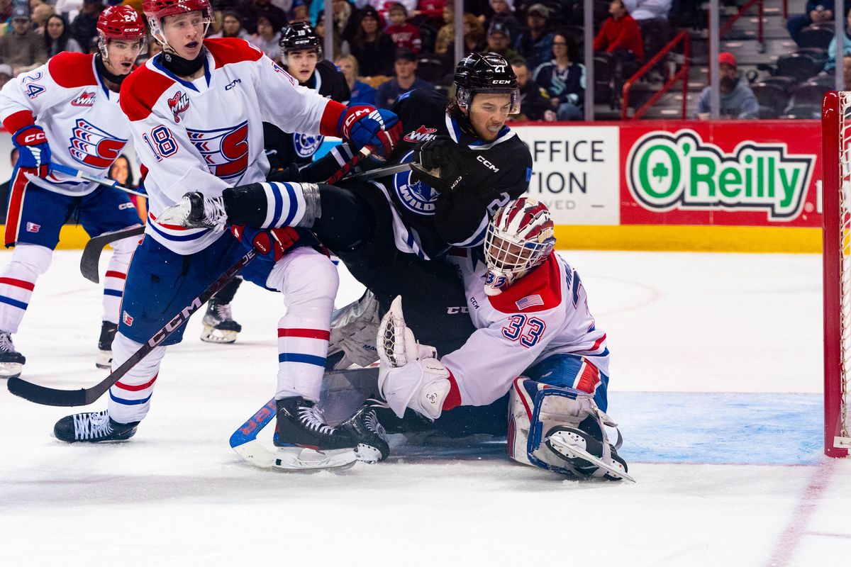 Spokane Chiefs goal Cooper Michaluk collides with Wenatchee Wild forward Luka Shcherbyna in the first period at the Spokane Arena on Sunday, Dec. 10, 2023. (Larry Brunt/Spokane Chiefs)