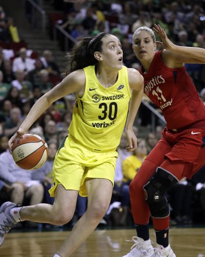 In this Sept. 7, 2018, file photo, Seattle Storm’s Breanna Stewart  drives past Washington Mystics’ Elena Delle Donne during the first half of Game 1 of the WNBA finals in Seattle. Reigning WNBA MVP Stewart is expected to miss the upcoming season after she ruptured the Achilles tendon in her right leg. (Elaine Thompson / AP)