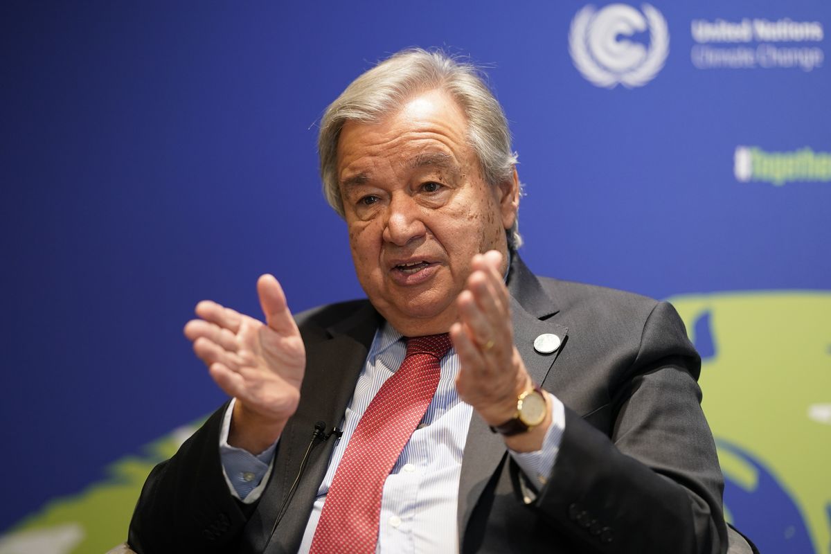 UN Secretary-General Antonio Guterres gestures during an interview at the COP26 U.N. Climate Summit in Glasgow, Scotland, Thursday, Nov. 11, 2021. Guterres says the Paris temperature goal of limiting warming to 1.5 degrees "is on life support" with climate talks so far not reaching any of the U.N.