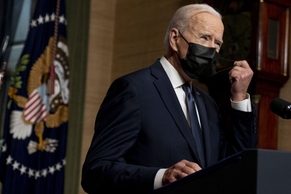 FILE - In this Wednesday, April 14, 2021, file photo, President Joe Biden removes his mask to speak at a news conference at the White House, in Washington. Ten liberal senators are urging Biden to back India and South Africa’s appeal to the World Trade Organization to temporarily relax intellectual property rules so coronavirus vaccines can be manufactured by nations that are struggling to inoculate their population.  (Andrew Harnik)