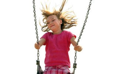
Dalton Elementary School fifth-grader Emily DeMarcus  swings Thursday during recess. The school is trying out a 