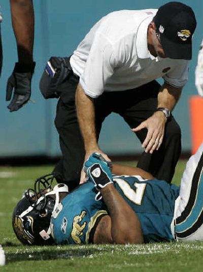 
Jacksonville's Fred Taylor bruised his right ankle Nov. 6 against Houston. 
 (Associated Press / The Spokesman-Review)