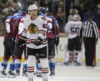 The unbeaten streak has ended for Michael Frolik (67) and the Blackhawks after losing to Colorado. (Associated Press)