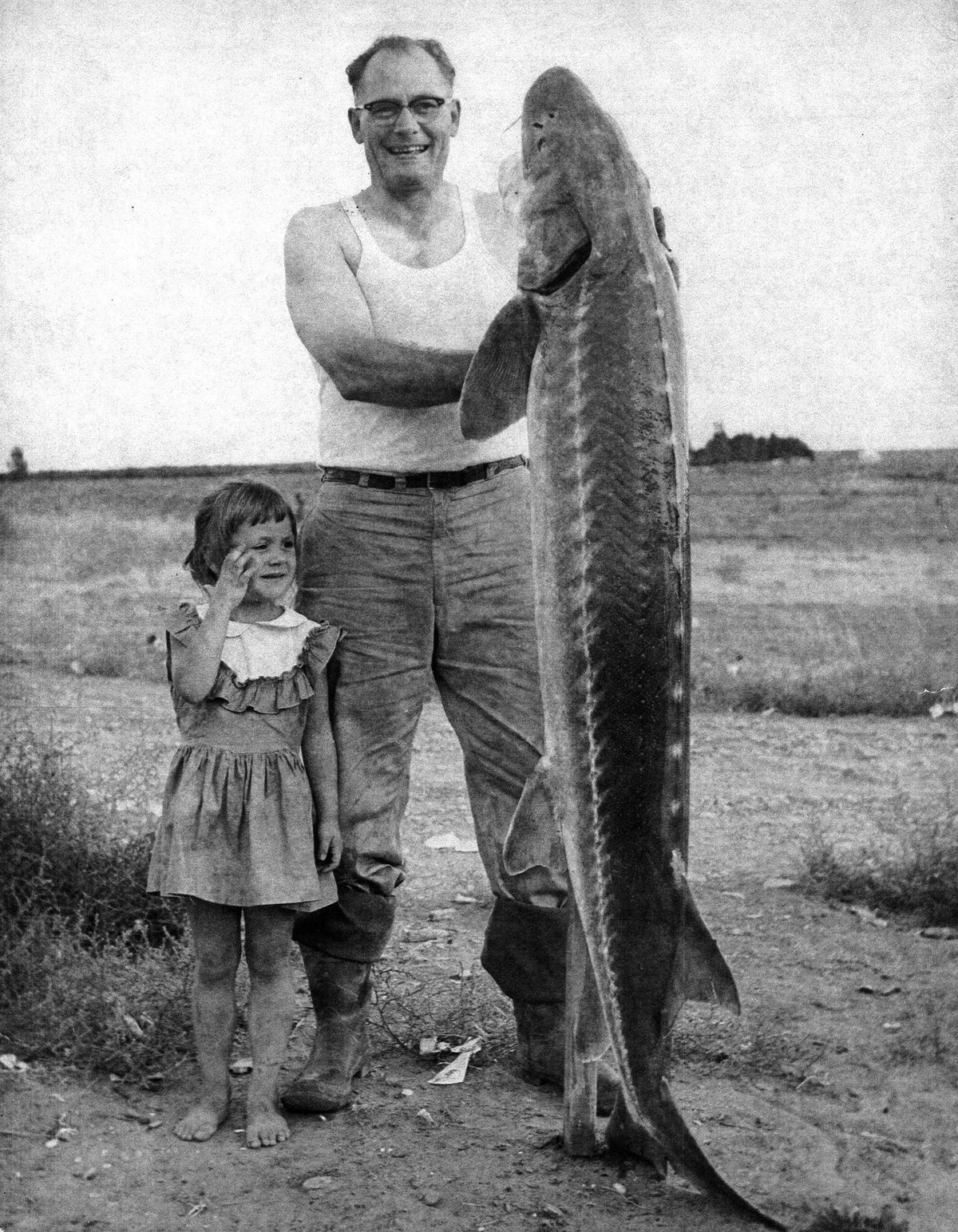 Deborah Clark as a young girl with her uncle on the shores of the Columbia River.