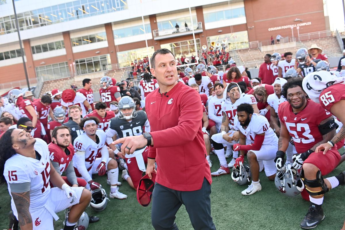 Washington State coach Jake Dickert rallies his team after WSU’s Crimson and Gray spring game on April 23 at Gesa Field in Pullman. Dickert will open his first fall camp as Cougs