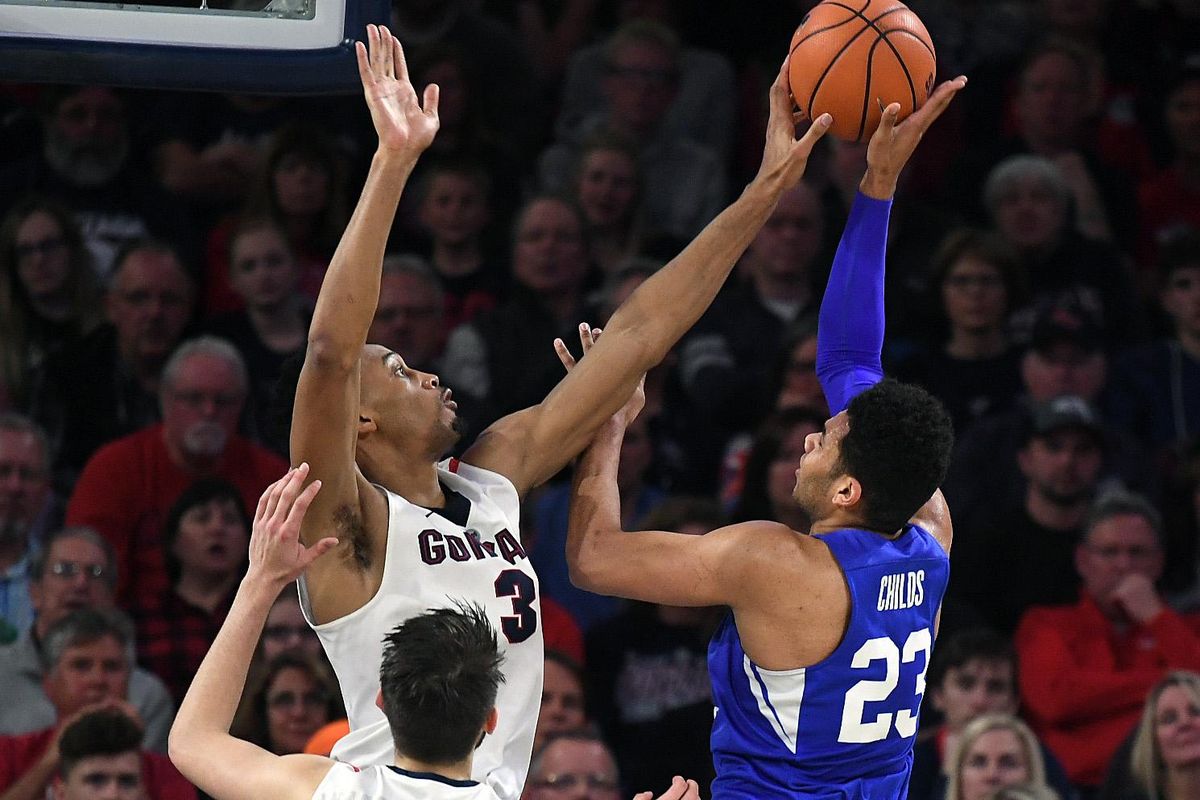 Gonzaga forward Johnathan Williams (3) blocks a shot by BYU forward Yoeli Childs (23) during a NCAA college basketball game, Sat., Feb. 3, 2018, in the McCarthey Athletic Center. (Colin Mulvany / The Spokesman-Review)