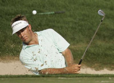 
Stuart Appleby blasts out of a bunker on No. 18.
 (Associated Press / The Spokesman-Review)