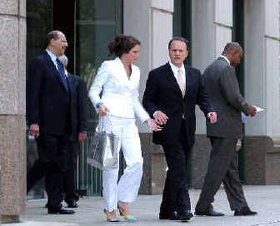 
Former HealthSouth Corp. CEO Richard Scrushy, center right, and his wife Leslie leave the Hugo L. Black Federal Courthouse for lunch Wednesday.
 (Associated Press / The Spokesman-Review)