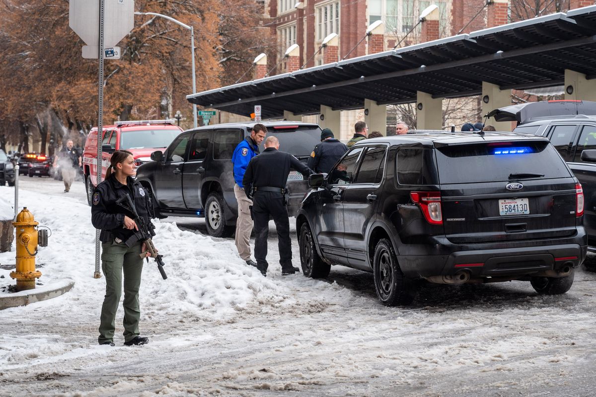 Law enforcement swarm Lewis and Clark High School Friday after a report of a school shooting later determined to be hoax. Police said they had swept the entire school and found no indication of a shooting.  (COLIN MULVANY/THE SPOKESMAN-REVI)