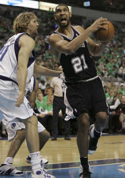 
Spurs forward Tim Duncan drives against Dirk Nowitzki of Dallas. Associated Press
 (Associated Press / The Spokesman-Review)