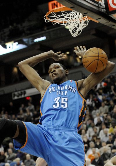 Oklahoma City’s Kevin Durant dunks on the way to 47 points Wednesday.  (Associated Press)