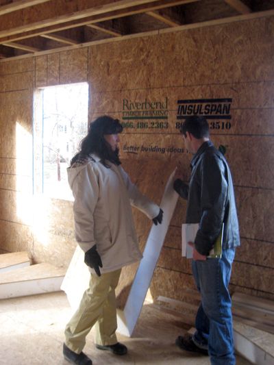 Homeowner Anjali Hansen consults with Charles Byrd, chief executive of IntelliStructures, which is installing special insulation in her 4,000-square-foot house in Falls Church, Va. Washington Post (Washington Post / The Spokesman-Review)