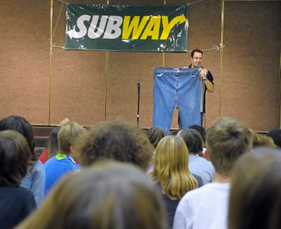 Jared Fogle holds up his 60-inch waistline pants that at one time were too tight for him to wear. Fogle is helping kick off the 