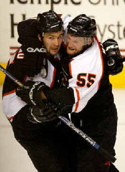 
Philadelphia Flyers Keith Primeau,left, is hugged by teammate Danny Markov after scoring a goal. Philadelphia Flyers Keith Primeau,left, is hugged by teammate Danny Markov after scoring a goal. 
 (Associated PressAssociated Press / The Spokesman-Review)