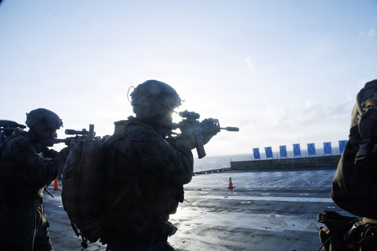 U.S. Marines with Lima Company, Battalion Landing Team 3rd Battalion, 1st Marine Regiment, 31st Marine Expeditionary Unit, conduct a live fire deck shoot on March 16 aboard the amphibious assault ship USS Tripoli in the Philippine Sea.  (Cpl. Eric Reyes/U.S. Marine Corps)