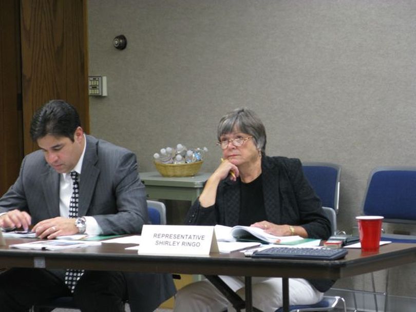 Rep. Shirley Ringo, D-Moscow, right, mulls options for funding parks and state police when they lose gas tax revenues. At left is Rep. Raul Labrador, R-Eagle. (Betsy Russell / The Spokesman-Review)