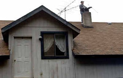 Joe Schindler of Fireman Joe's Chimney Sweep cleans out a chimney at a home in Post Falls.Joe Schindler of Fireman Joe's Chimney Sweep cleans out a chimney at a home in Post Falls.
(Kathy Plonka/Kathy Plonka/ / The Spokesman-Review)