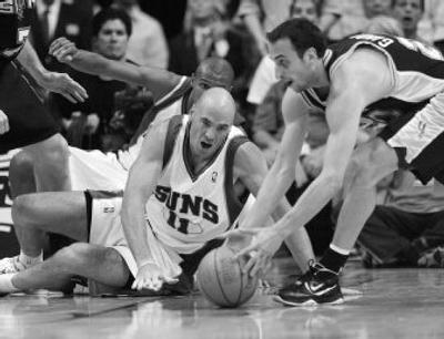 
Phoenix Suns' Pat Burke fights unsuccessfully for a loose ball against San Antonio Spurs' Manu Ginobili. 
 (Associated Press / The Spokesman-Review)