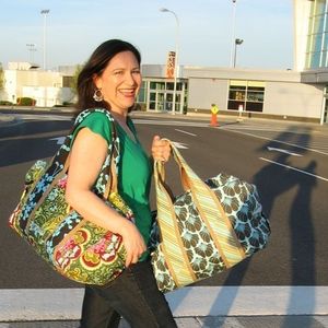 Spokane resident Cherie Killilea models her handmade duffel bags at the Spokane International Airport. Simplicity Creative Group, the large sewing-pattern maker, has a licensing agreement with Killilea to sell three of her patterns under the label Studio Cherie. (www.studiocherie.etsy.com)