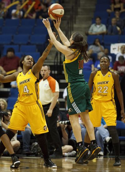 Tulsa’s forward Amber Holt tries to block a shot by Sue Bird. (Associated Press)