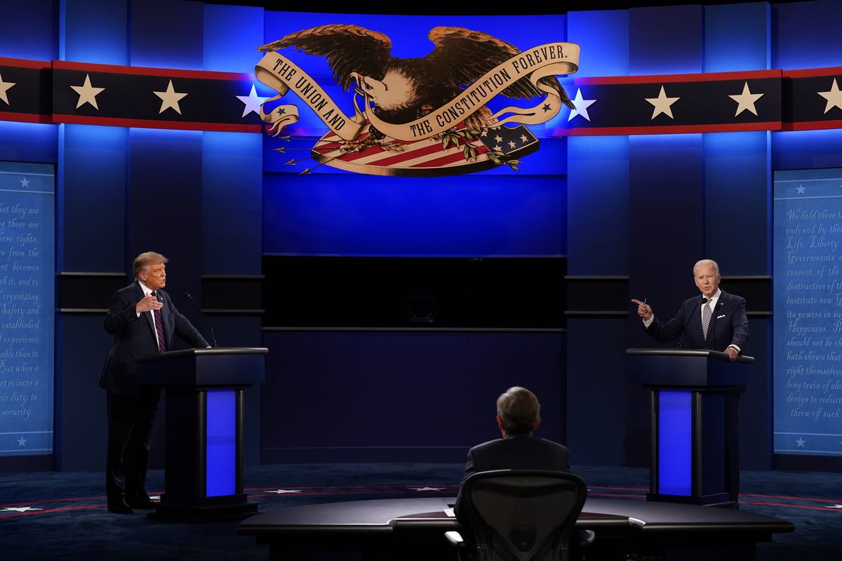 President Donald Trump, left, and Democratic presidential candidate former Vice President Joe Biden, right, with moderator Chris Wallace, center, of Fox News during the first presidential debate Tuesday, Sept. 29, 2020, at Case Western University and Cleveland Clinic, in Cleveland, Ohio. (AP Photo/Patrick Semansky) ORG XMIT: DBT120  (Patrick Semansky / Associated Press)
